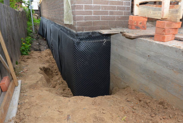 SJ Waterproofing Pros technician performing targeted Vapor Barrier Installation assessment in Ramsey, MN